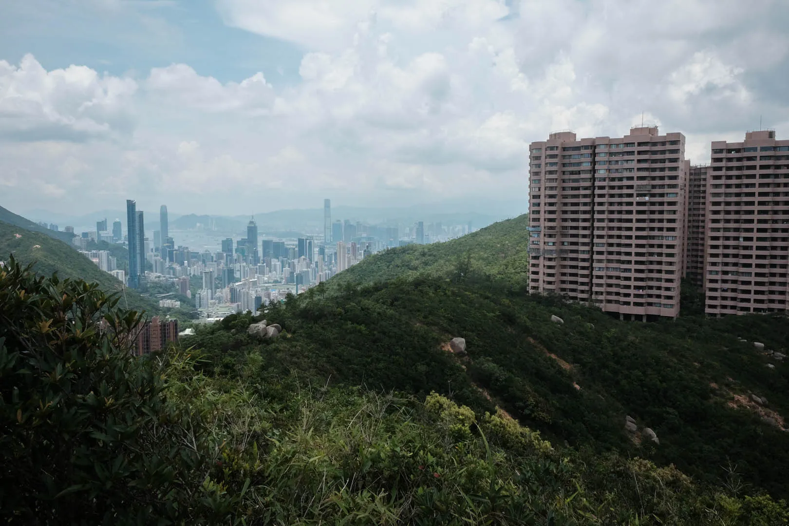 View of Parkview Heights and Island cityscape from the initial ascent to Violet Hill from Wong Nai Chung Reservoir